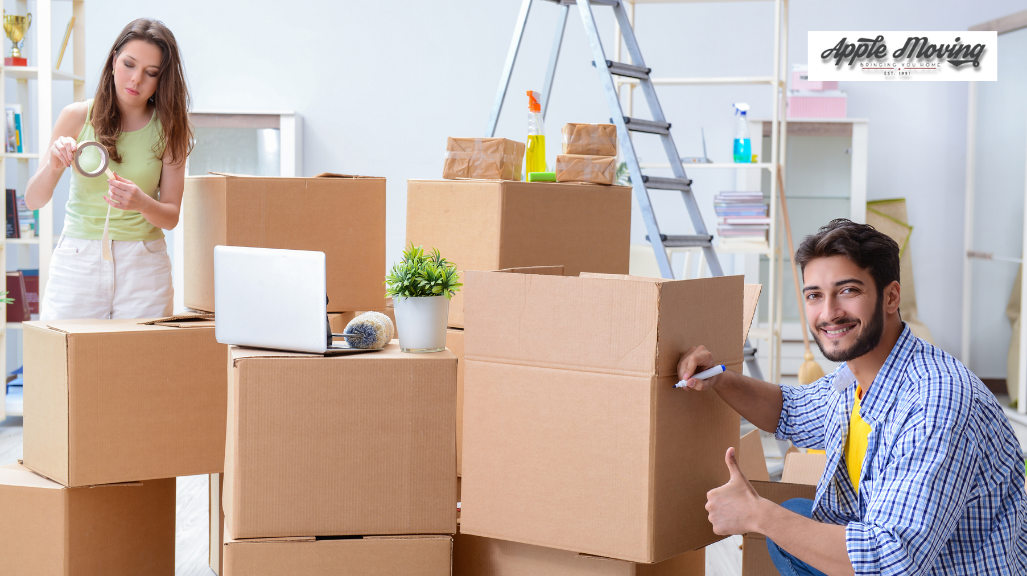 man labeling cardboard box