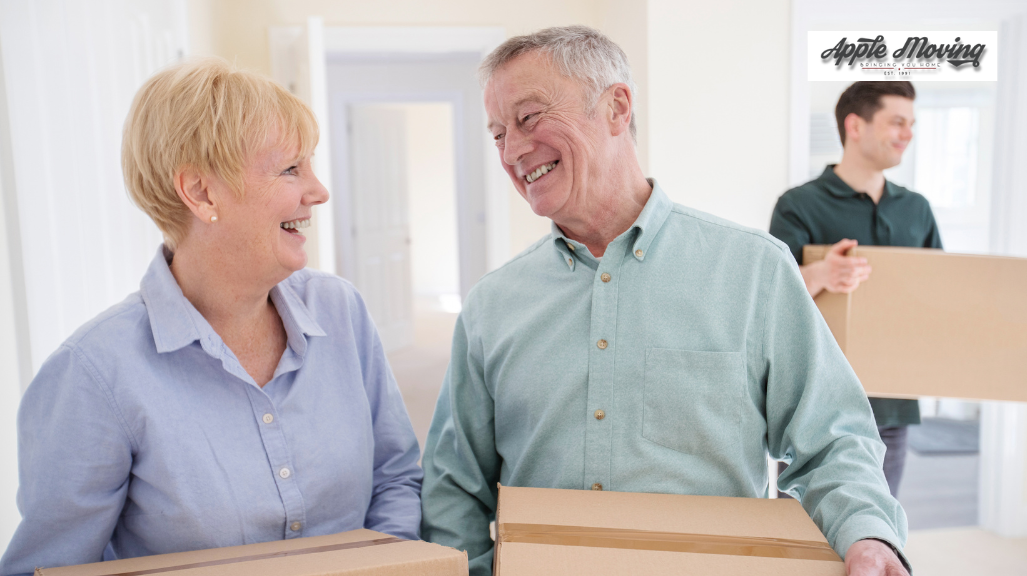 two seniors lifting boxes